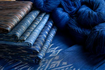 Fotobehang Crafts and craftsmanship. Traditional Isan Thai silk indigo weaving.Craftsmen of Thai Silk. © saravut