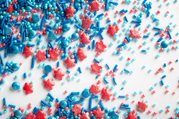 Colorful sweet background with colorful sprinkles. Cupcake and Ice cream topping. Sweet Texture. Sweet Background. Holiday treat. Varied sugar sprinkles, stars, flowers, dots.