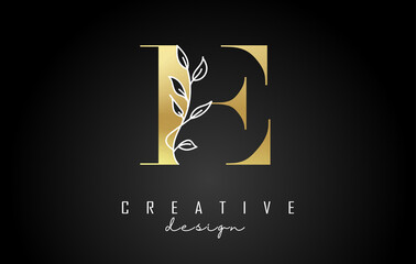 Golden E letter logo design with white leaves branch vector illustration.