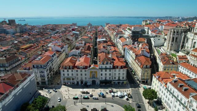 Aerial view over the Rua Augusta street and the Rossio square in Lisbon - reverse, drone shot