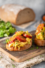 Scrambled eggs with sausage and herbs