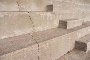 Detail of a football stadium staircase and grandstand made of concrete with a crack