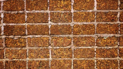 Walls with large red stone textures are lined up in layers for the background.