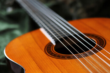 Fototapeta premium close-up natural wood acoustic guitar