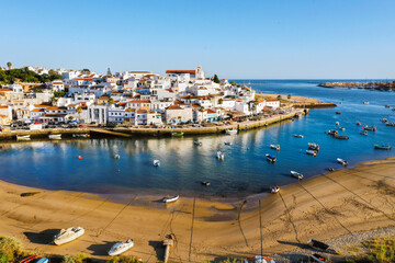 Aerial cityscape of Ferragudo by Arade River, Algarve, Portugal