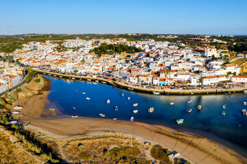 Aerial cityscape of Ferragudo by Arade River, Algarve, Portugal