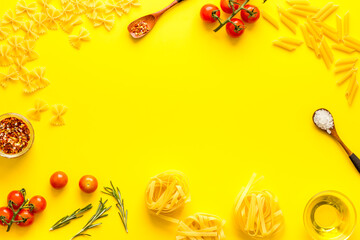Frame of fettuccine with ingredients for cooking italian pasta