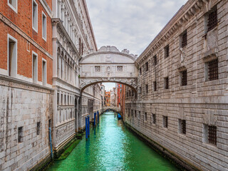 Small canal leading to the famous Bridge of Sighs (Ponte dei Sospiri) in Venice, Italy.