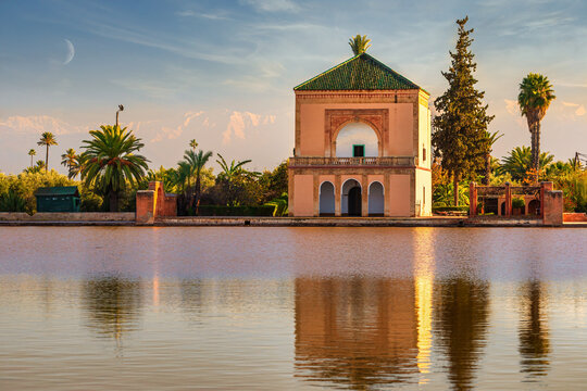 Menara Pavilion reflected on lake in late afternoon sunshine in Marrakesh, Morocco