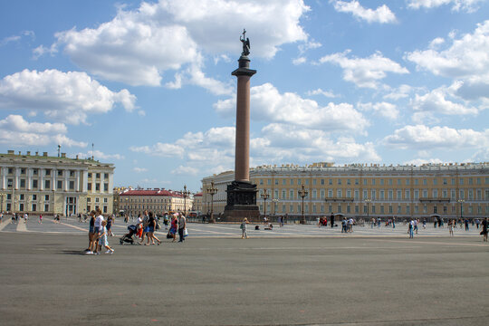 SAINT PETERSBURG, RUSSIA-JULY, 18, 2021: panoramic view of the Palace Square with the Alexander Column and tourists on a cloudy summer day