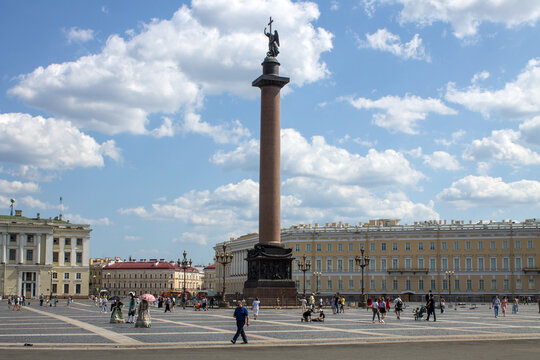 SAINT PETERSBURG, RUSSIA-JULY, 18, 2021: panoramic view of the Palace Square with the Alexander Column and tourists on a cloudy summer day