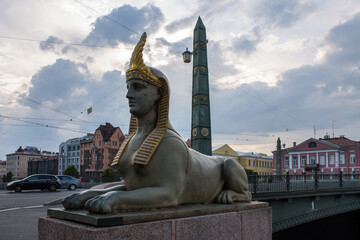 SAINT PETERSBURG, RUSSIA-JULY, 18, 2021: Stone Sphinx statue on the Egyptian Bridge at sunset on a summer evening