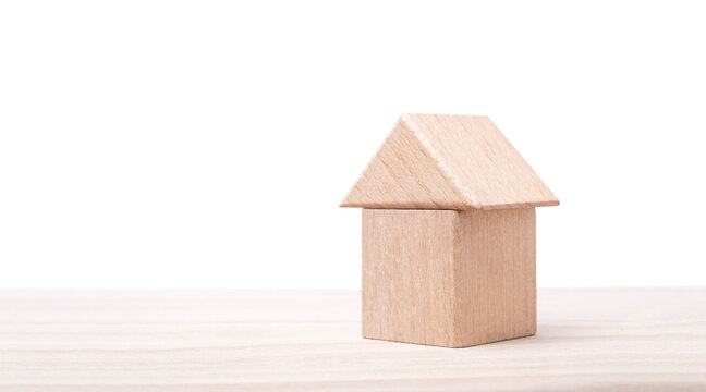 a wooden house on table for decoration. wood toys similar home. real image , studio shot.