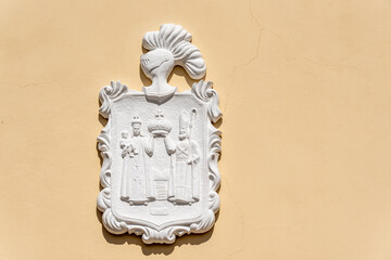 Colonial Catholic Coat of Arms decorating the exterior walls of the Cathedral of Holguin, Cuba