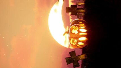 vertical Halloween animated 4k background. scary and Spooky pumpkin in fire. around mystic evening and cemetery . High quality 4k footage - Powered by Adobe