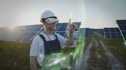 Adult man engineer using VR glasses checking solar battery panels tapping online. 3D graphic system. Sunset sky. Futuristic technology innovation. Eco business trend. Virtual reality inspiration. 5G
