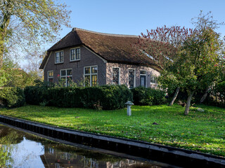Centuries-old thatched-roof houses in Giethoorn, Steenwijkerland,  Overijssel Province, The Netherlands