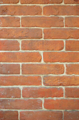 Old red brick walls. Old restored masonry. Historical and cultural heritage. Brick background.