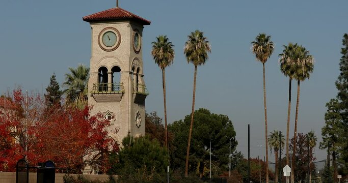 Daytime view of a historic public clock tower in downtown Bakersfield, California, USA.