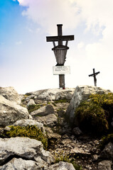Mountain summit cross on the top of the alps