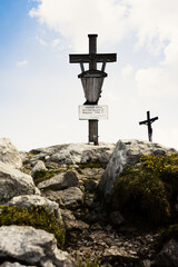 Mountain summit cross on the top of the alps