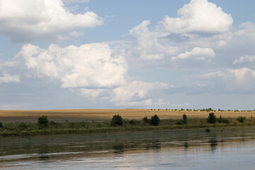 Fototapeta na wymiar river and sky with clouds