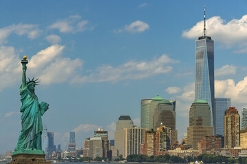Panorama view of Statue of Liberty with Manhattan downtown skyscraper in lower Manhattan, New York...