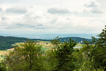 Fototapeta na wymiar View from the Jura hills towards over the cloister Mariastein towards Basel city, Switzerland
