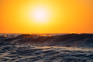 Sea wave close up, low angle view, sunrise shot