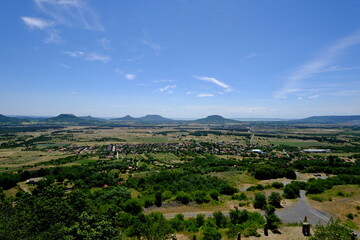 panoramic view of volcanic hills with village