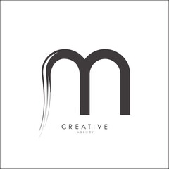 Letter M Brushstroke Logo Design. Black Paint Logo Letter Icon with Elegant Circle Vector Design.


