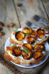 Bruschetta with dried apricots. Healthy sandwiches with apricot and white cheese.