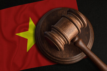 Judge Gavel and flag of Vietnam. Law and justice in Socialist Republic of Vietnam. Violation of...