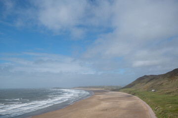 Rhossili Bay in the Gower Peninsula on a summer's day in Swansea, Wales