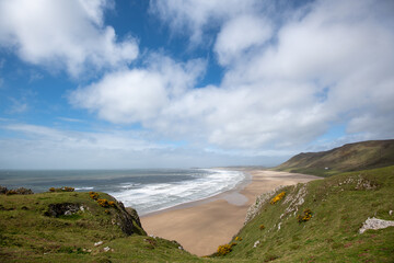 Rhossili Bay in the Gower Peninsula on a summer's day in Swansea, Wales