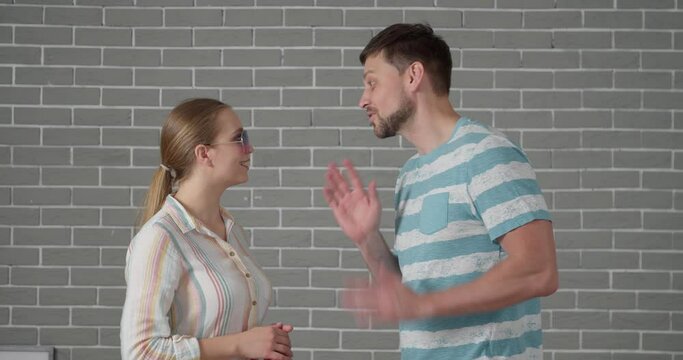 Gossiping people on brick background