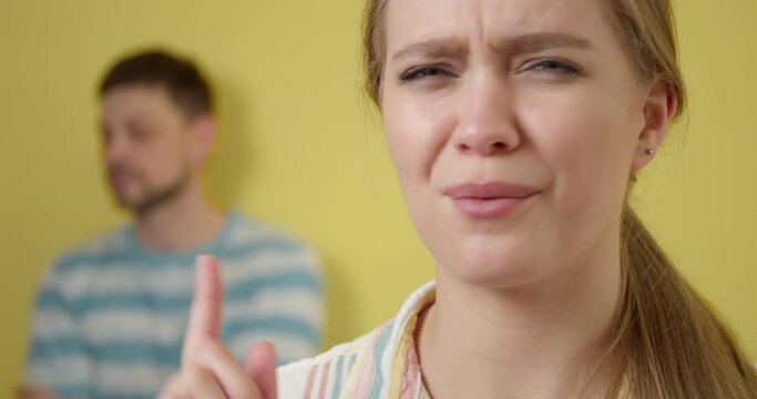 Young gossiping woman on color background