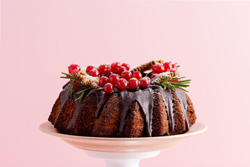 Holiday cake at light pink background. Minimal picture of Christmas and New year food