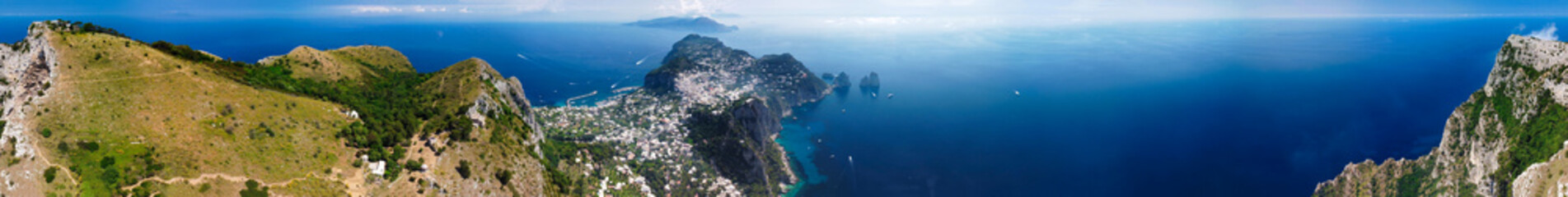 Capri coastline from a high flying drone over Mt Solaro in summer season.