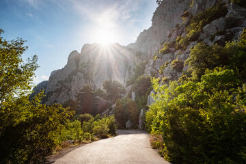 asphalted road in the mountains, beautiful sunshine, summer vacation time © Seleznov_Molchanova