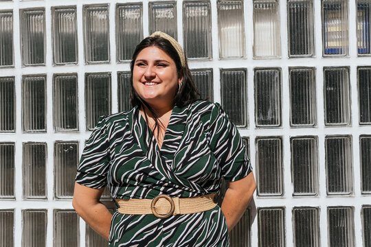 Modern plus size woman in elegant outfit