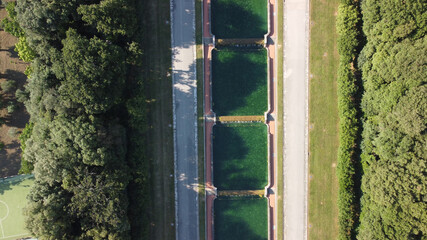 Reggia di Caserta, Italy. Aerial view of famous royal building gardens from a drone in summer season.