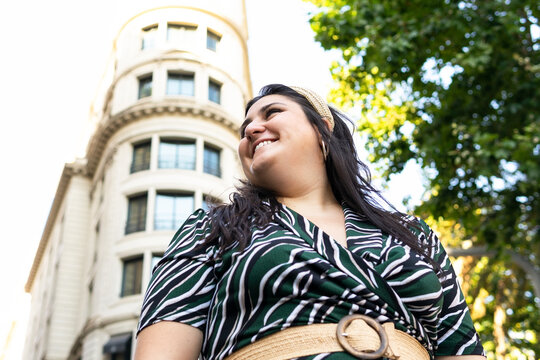 Modern plus size woman in elegant outfit