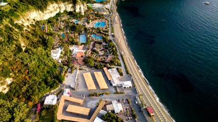 Overhead aerial view of Ischia Citara Beach at sunset with sand. - obrazy, fototapety, plakaty