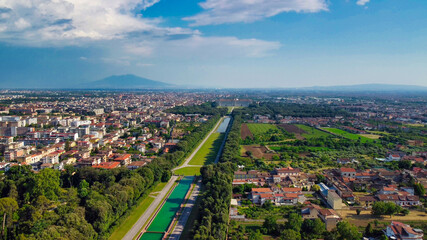 Reggia di Caserta, Italy. Aerial view of famous royal building gardens from a drone in summer...