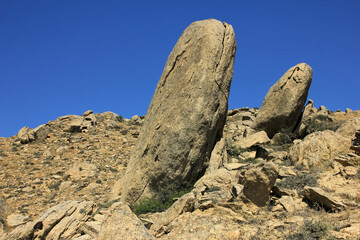 Large stones against the blue sky.