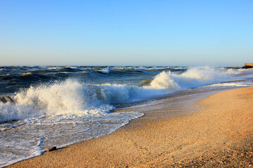 Storm at sea at sunset.