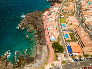 Tenerife, San Juan a town on the Atlantic Ocean. Sunny coast and port city. Ocean, water, waves,...