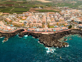 Tenerife, San Juan a town on the Atlantic Ocean. Sunny coast and port city. Ocean, water, waves,...