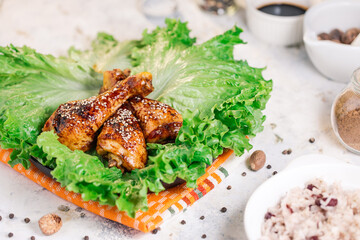Roasted chicken thighs on a green salad 